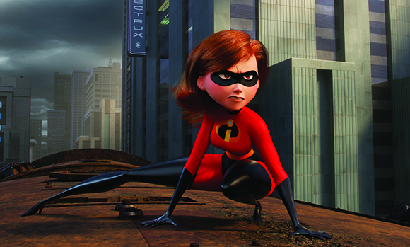 A red-haired female superhero in a red and black suit crouches on a rooftop overlooking a city.