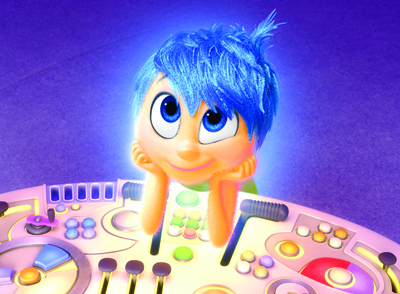 A blue-haired animated character with large blue eyes rests their chin on their hands over a glowing control panel.