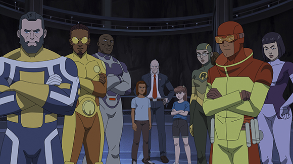 A group of diverse animated superheroes and a man in a suit stand in a dark, circular room.