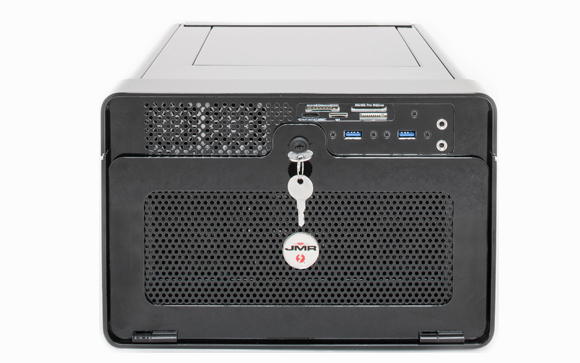Rear of a black electronic safe featuring USB and HDMI ports, a key in the lock, and a mesh panel.