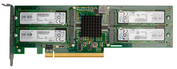 A green circuit board with four white memory modules and a black central heatsink on a gold connector base.