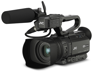 A black JVC professional video camera with a large lens and a shotgun microphone on top.