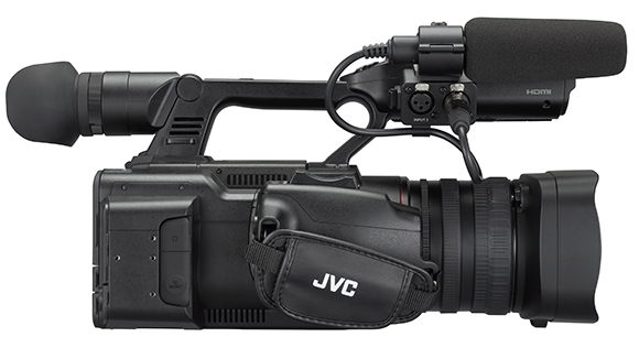 A black JVC professional video camera with a large lens, a top handle, and a microphone attached.