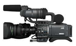 A professional grey JVC video camera with a large lens and microphone.