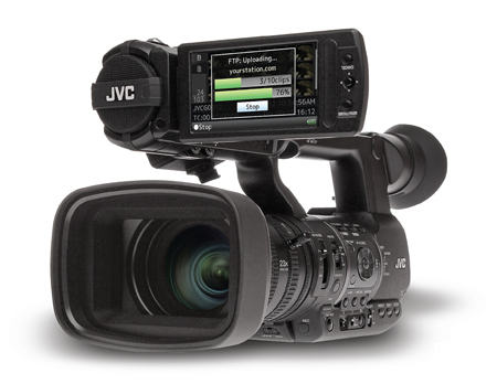 A black JVC professional video camera showing an FTP upload progress bar on its LCD screen.