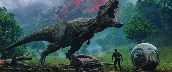 A large Tyrannosaurus Rex roars with its mouth open in a misty, green jungle.