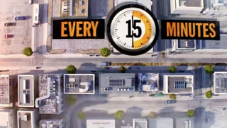 Aerial view of city streets and buildings with text reading 'EVERY 15 MINUTES' and a clock icon.