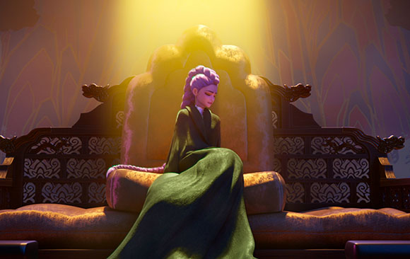 A woman with purple hair in a green gown sits on an ornate, large throne under a bright spotlight.