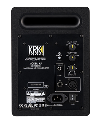 The rear control panel of a KRK K5 studio monitor showing various input jacks and adjustment knobs.