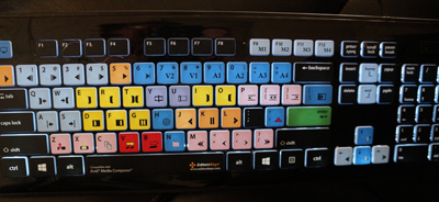 A computer keyboard featuring various brightly colored keys in yellow, red, blue, and green.