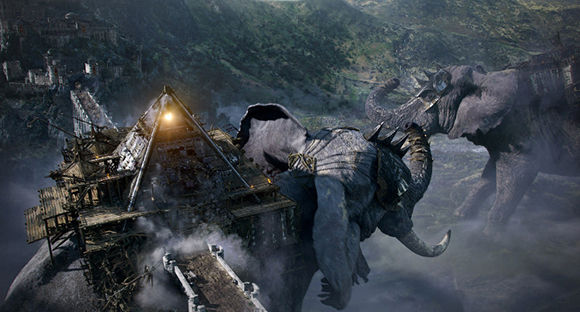 Two massive, armored elephants charge toward a wooden building in a misty, mountainous valley.