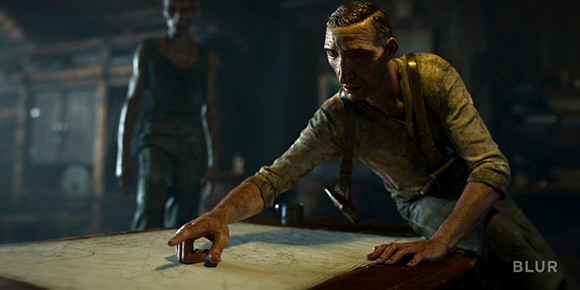 A man in a light-colored shirt leans over a table in a dark, rustic room.