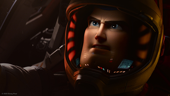 Close-up of an animated man with blue eyes looking upward through a glass space helmet visor.
