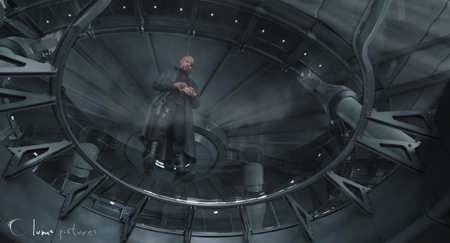 A man in dark clothing stands inside a large, circular, metallic, futuristic-looking chamber.