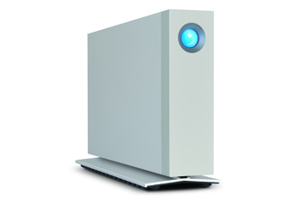 A white rectangular computer tower with a glowing blue circular light on the front panel.