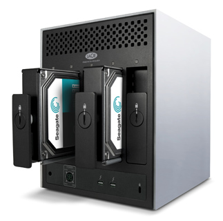 A white and black LaCie external storage enclosure with two Seagate hard drives being inserted.