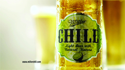 A condensation-covered bottle of Miller Chill light beer with a green label.