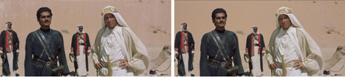Four men in traditional Middle Eastern clothing stand in a desert with a camel in the background.