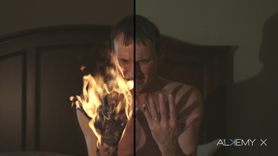 Split view of a man's hand; the left side shows the hand engulfed in flames, while the right side shows a normal hand.