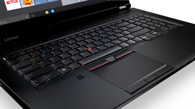 A black Lenovo laptop keyboard with a red TrackPoint button and a large trackpad.