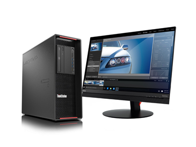A black Lenovo ThinkStation tower next to a wide computer monitor displaying photo editing software.