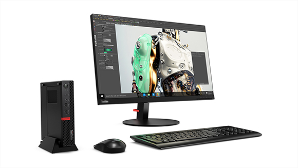 A desktop computer setup featuring a large monitor, a small black tower, a keyboard, and a mouse on a white background.