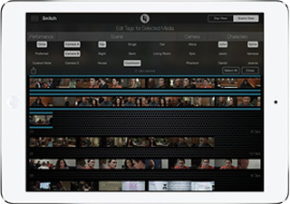 A white tablet showing a dark software interface with video thumbnails and text tags for media editing.