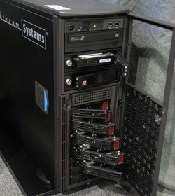 A black server tower with an open front door showing multiple drive bays and internal hardware.