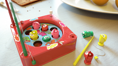 A red toy fishing game with various colorful plastic fish scattered on a table.