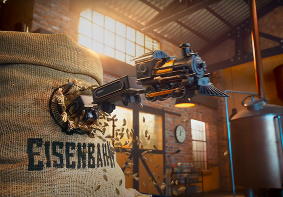 A toy steam engine bursts through a burlap sack filled with grain in a sunlit warehouse.