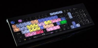 A black computer keyboard featuring various keys in shades of pink, blue, yellow, and green.