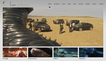Website showing a desert scene with several black SUVs and crew members, with a large CGI creature part in the foreground.