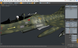 A 3D digital model of a camouflage-patterned fighter jet displayed in the Modo software interface.
