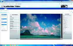 Website interface for Southridge Video showing a blue sky with pink-tinted clouds over a tropical island.