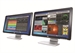 Two computer monitors side-by-side displaying colorful digital interfaces and data.