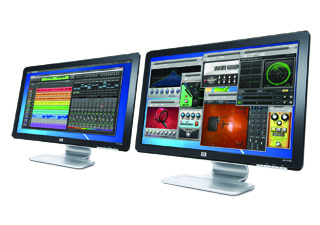 Two black computer monitors on silver stands displaying colorful digital interfaces and data.