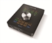 A black square audio controller with a large silver central knob and various colored buttons.
