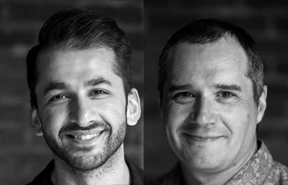 Black and white split portrait of two smiling men looking toward the camera.