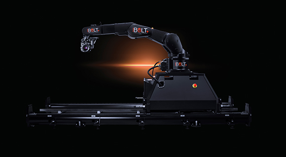 A black robotic camera arm with a mounted camera, positioned on a motorized track against a black background.