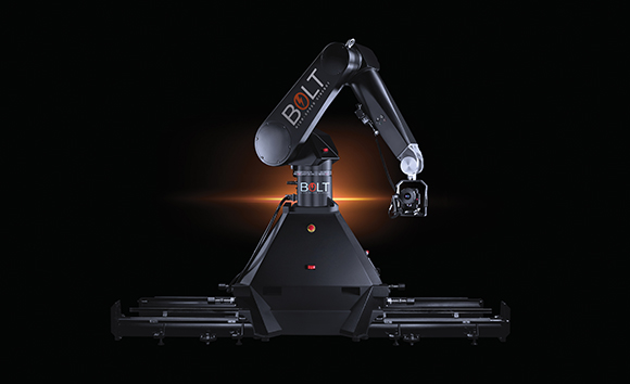 A black robotic arm mounted on a heavy motorized base against a black background.