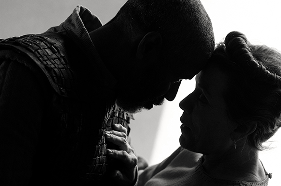 Black and white silhouette of a man and woman leaning in to touch foreheads.