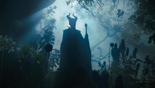 Silhouette of a horned figure holding a staff in a misty, sunlit forest.