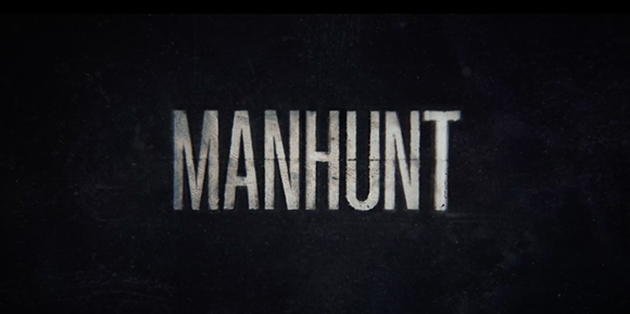 The word MANHUNT in distressed white capital letters on a dark, grainy background.