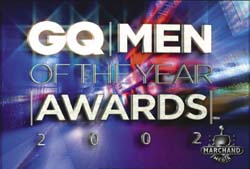 Graphic text reading GQ Men of the Year Awards 2002 against a colorful, abstract background.