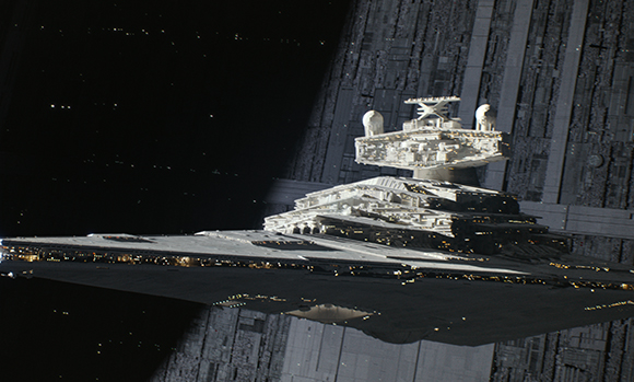 A large, wedge-shaped white starship with glowing lights floating in space near a massive gray structure.