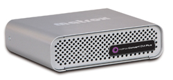 A rectangular silver Matrox Convert DVI Plus electronic device with a perforated front panel.