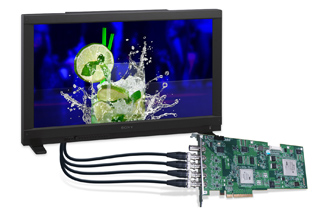 A black computer monitor showing a splashing lime drink next to a green printed circuit board with cables.