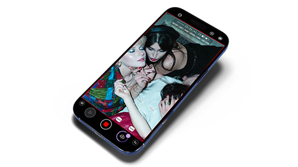 A smartphone screen showing a close-up video of two women posing closely together.