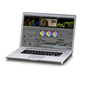 A silver laptop open on a white background, showing a video editing interface with color wheels and timelines.