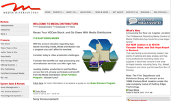 Website homepage for Media Distributors featuring news, product categories, and a green partners program announcement.